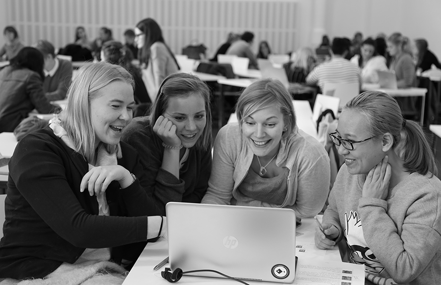 Group of women around a laptop