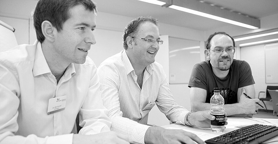 Men meeting around a computer